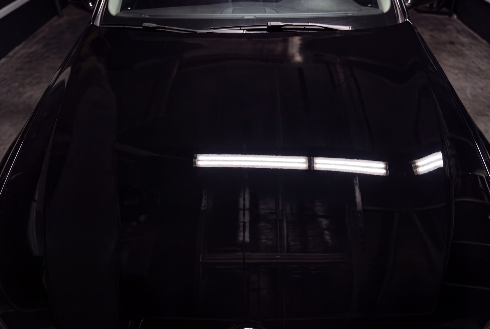 The same hood restored to a flawless mirror finish
